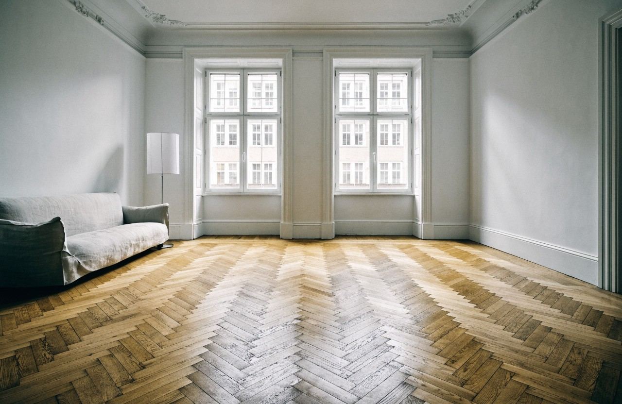 A room with a natural oak floor, illustrative